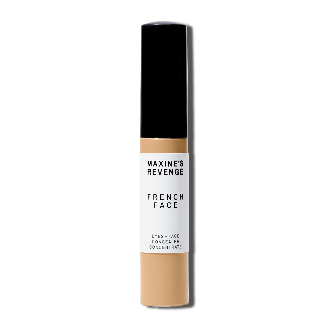 Maxine's Revenge French Face concealer shade Medium Beige tube on a white background; blurring hydrating, stretchy foundation concealer for a natural radiant beautiful complexion