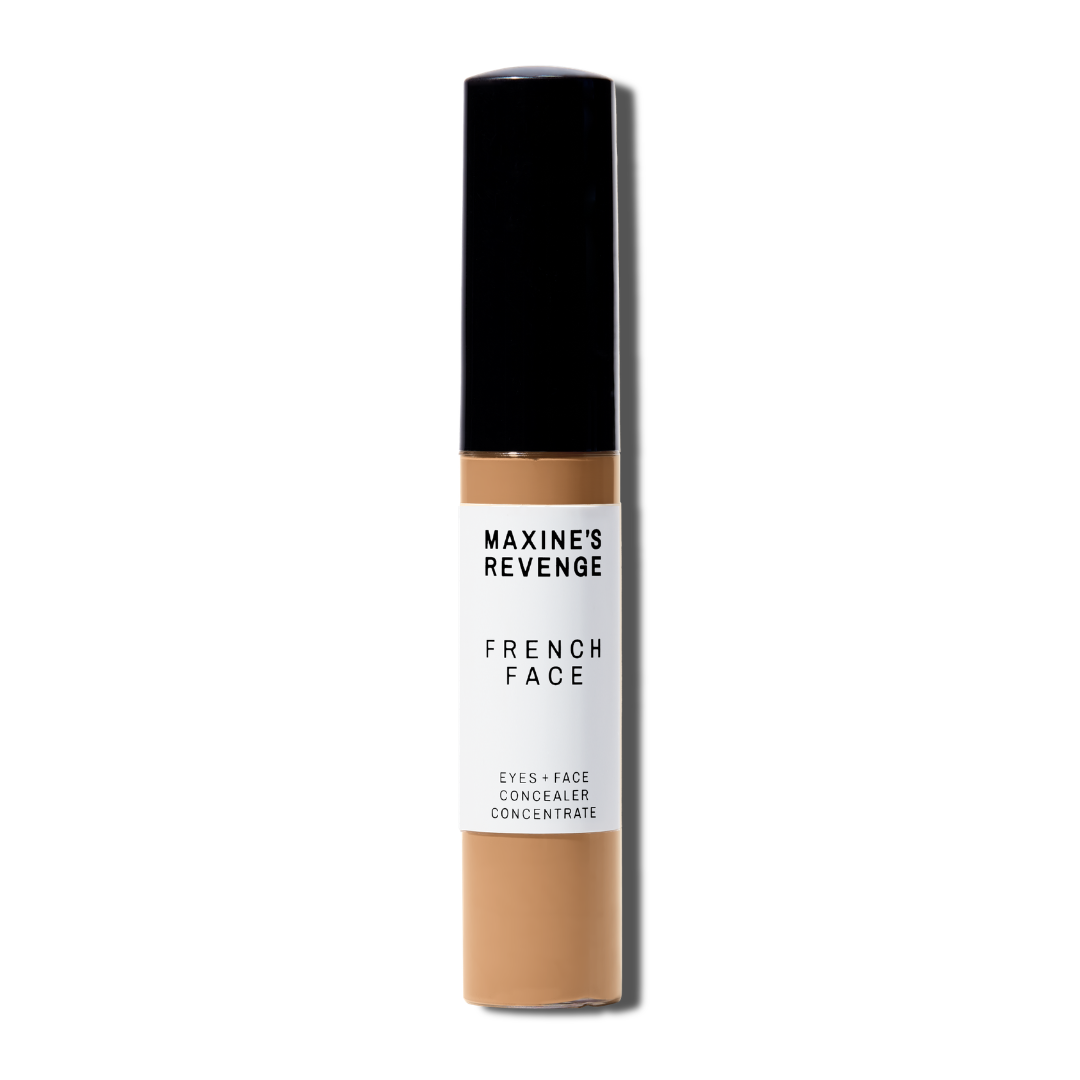 Maxine's Revenge French Face concealer shade Medium Deep Tan tube on a white background; blurring hydrating, stretchy foundation concealer for a natural radiant beautiful complexion