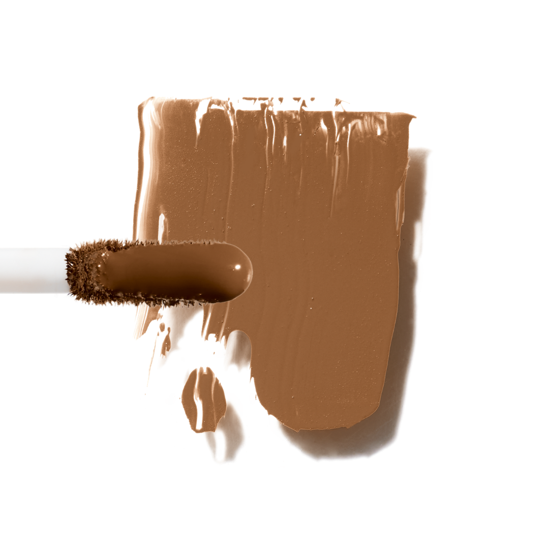 Maxine's Revenge French Face concealer shade Deep Cacao tube on a white background; blurring hydrating, stretchy foundation concealer for a natural radiant beautiful complexion