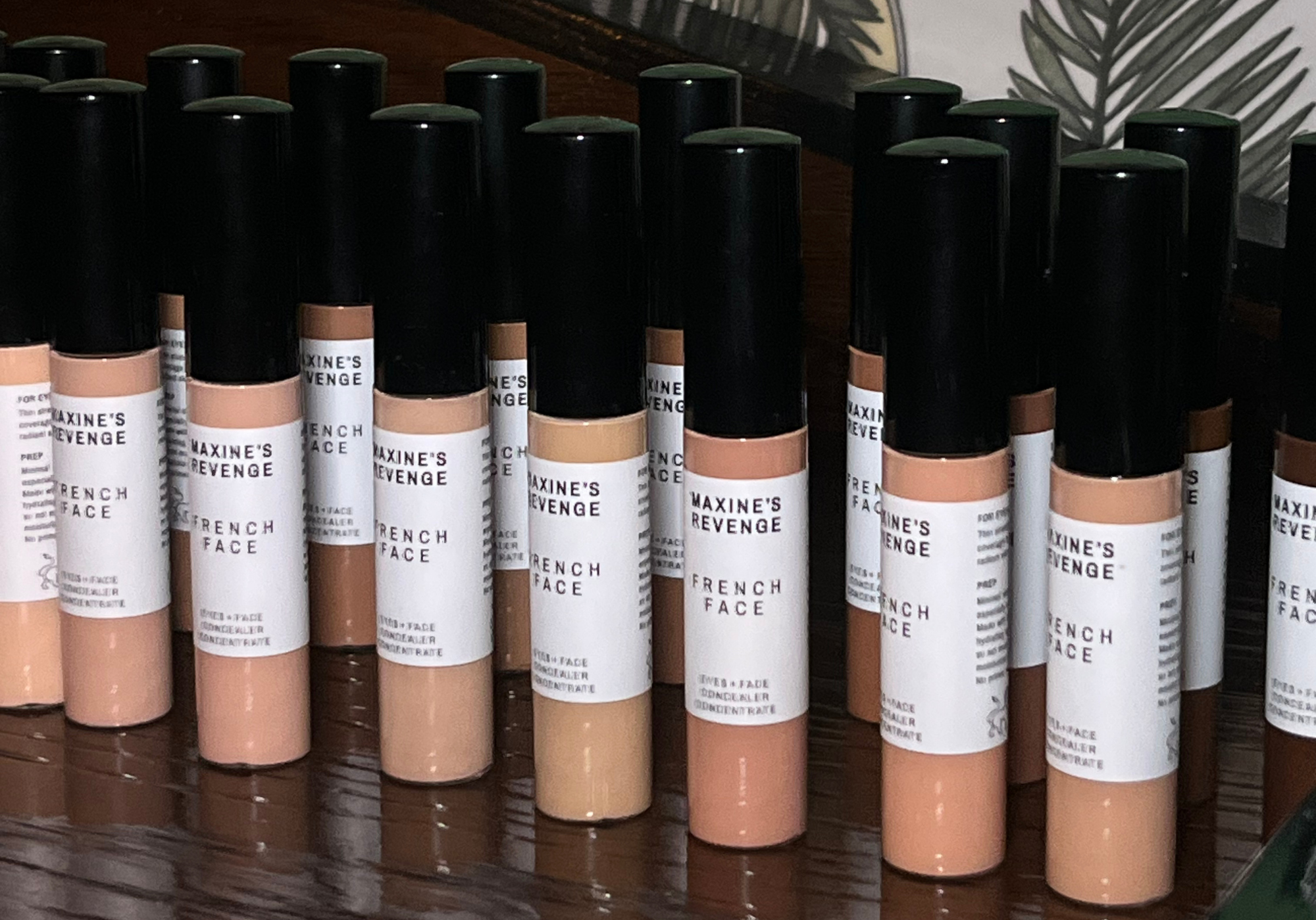 Row of Maxine's Revenge French Face products on a wooden surface