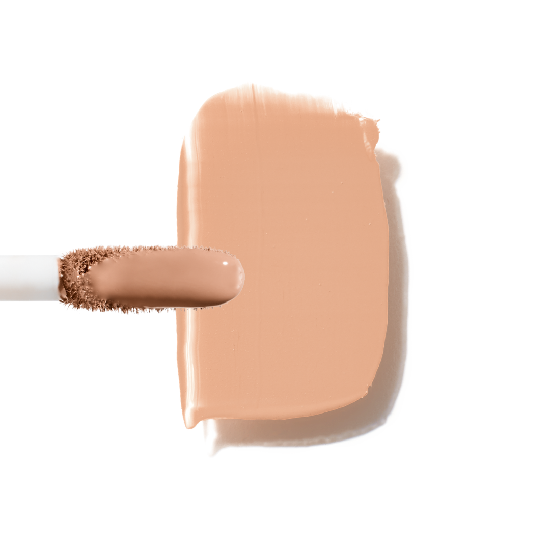 Maxine's Revenge French Face concealer shade Medium Peach tube on a white background; blurring hydrating, stretchy foundation concealer for a natural radiant beautiful complexion