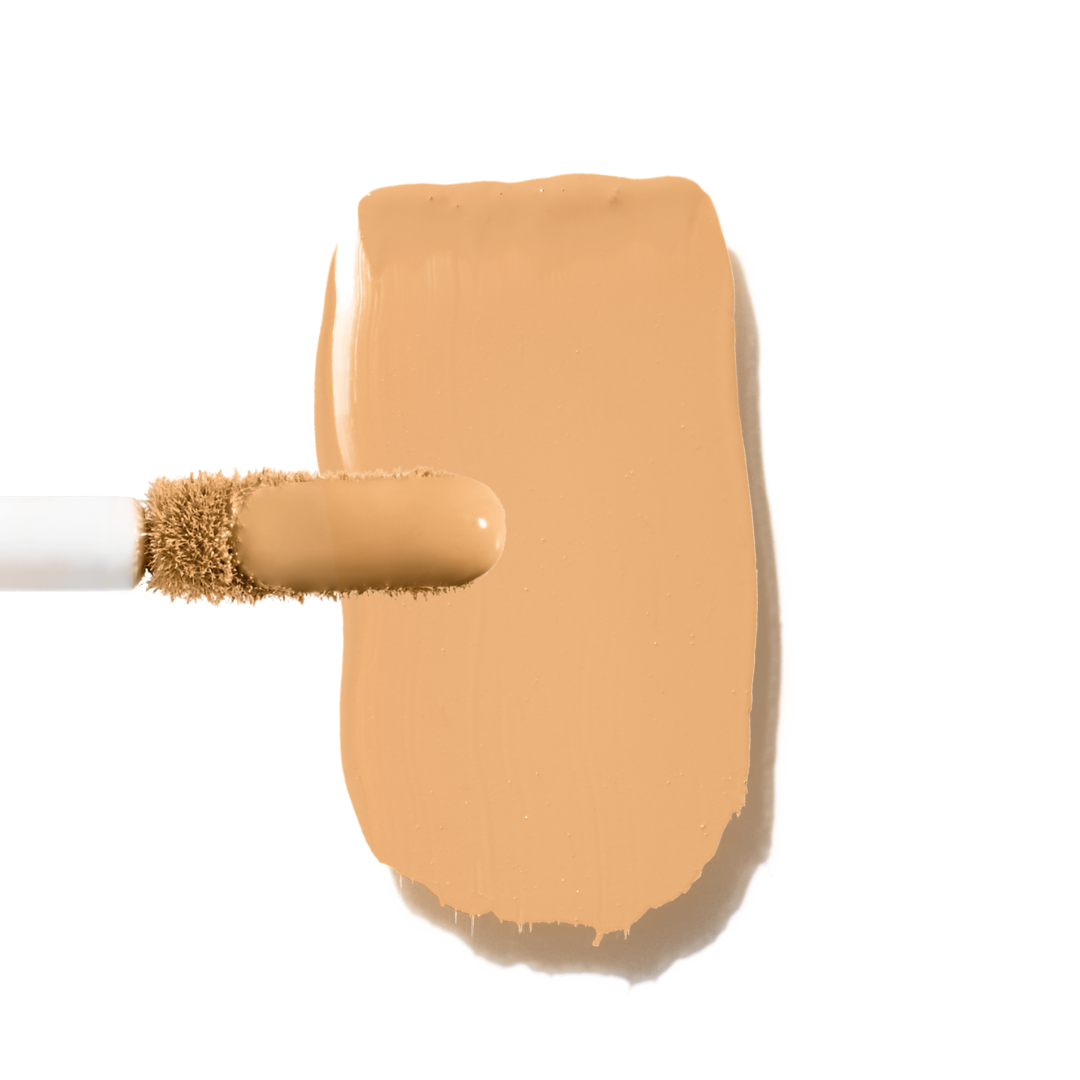 Maxine's Revenge French Face concealer shade Medium Beige tube on a white background; blurring hydrating, stretchy foundation concealer for a natural radiant beautiful complexion